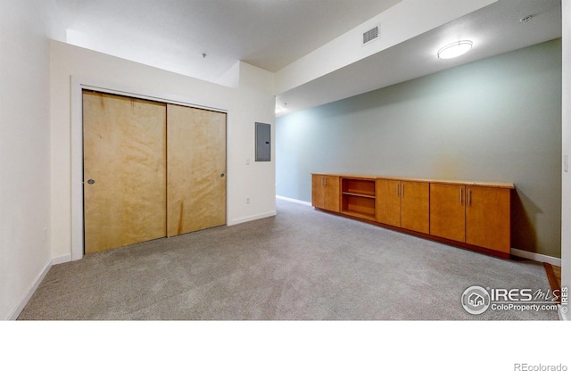 204 Maple St Unit 403, Fort Collins, CO 80521 - basement featuring electric panel, carpet floors, and baseboards