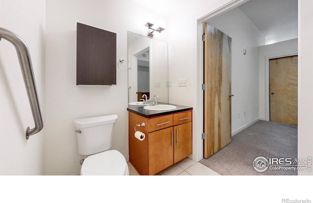 204 Maple St Unit 403, Fort Collins, CO 80521 - bathroom featuring toilet, vanity, and tile patterned flooring