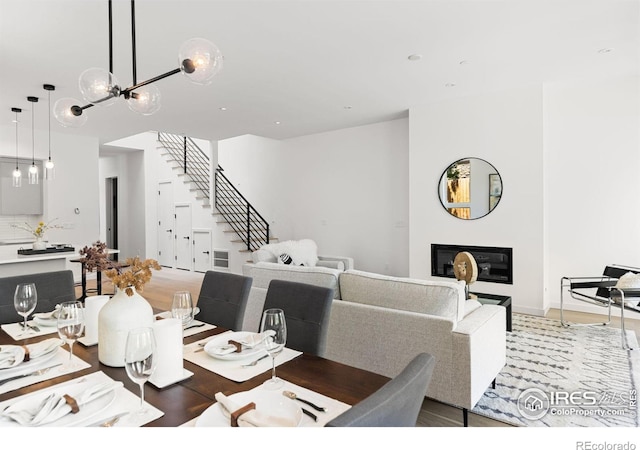 dining room featuring hardwood / wood-style floors and a chandelier