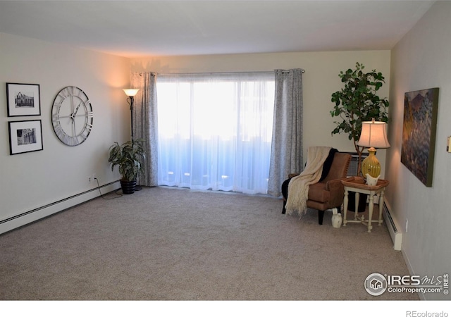 sitting room with baseboard heating and carpet floors