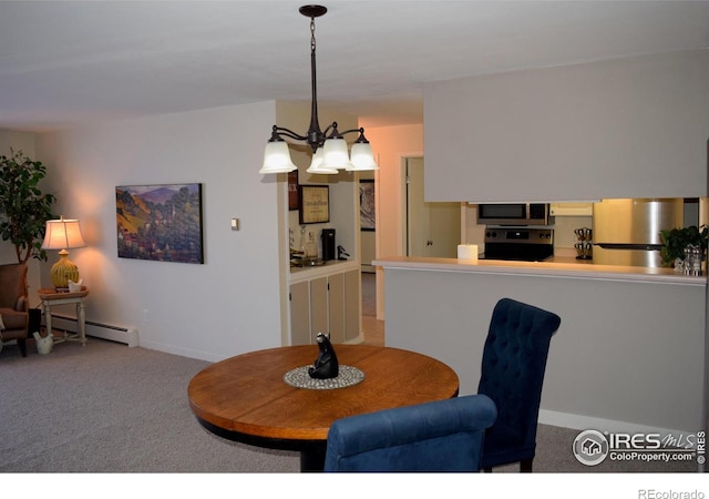 dining space with an inviting chandelier, a baseboard heating unit, and light colored carpet