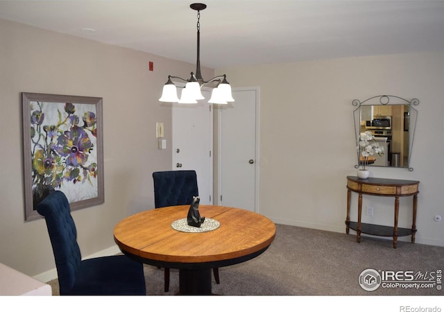 view of carpeted dining area