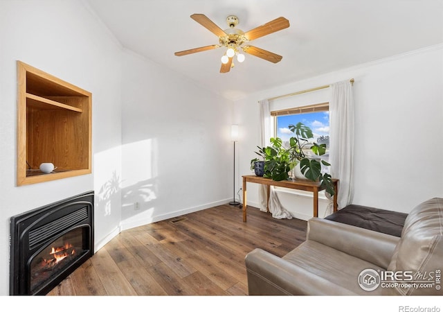 living room featuring ceiling fan, lofted ceiling, and dark hardwood / wood-style floors