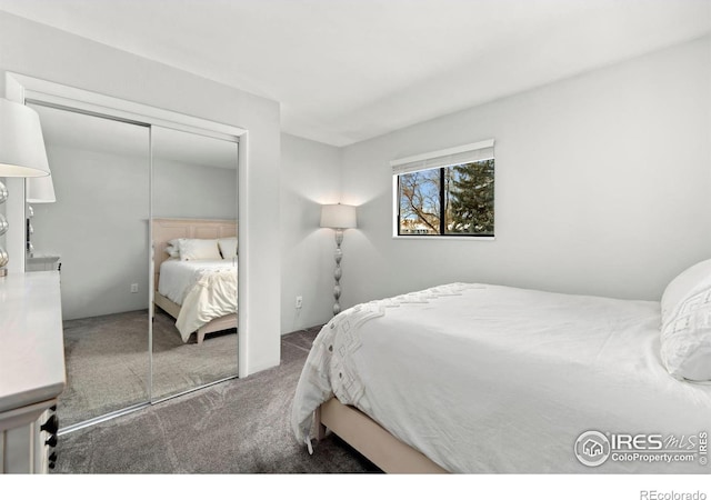 carpeted bedroom with a closet