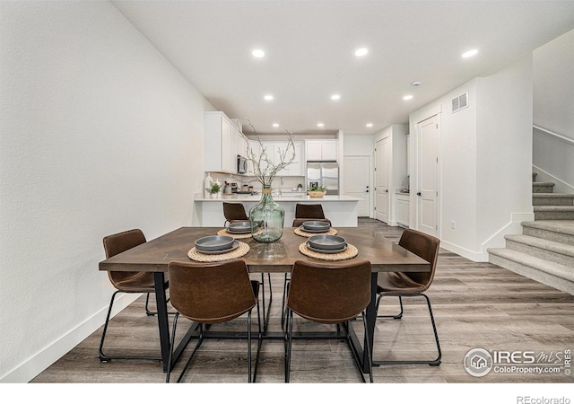 dining room with light wood-type flooring