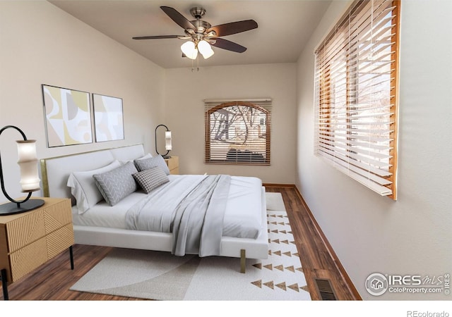 bedroom with wood finished floors and a ceiling fan