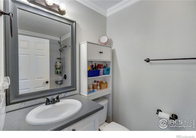 bathroom featuring ornamental molding, a shower, vanity, and toilet