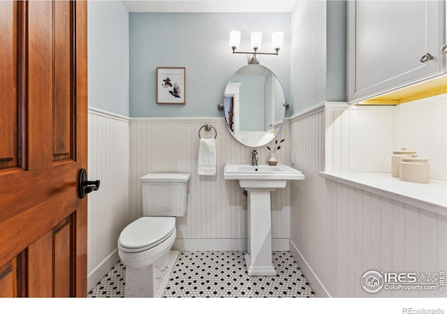 bathroom with tile patterned floors and toilet