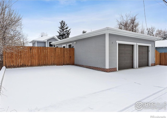 view of snow covered garage