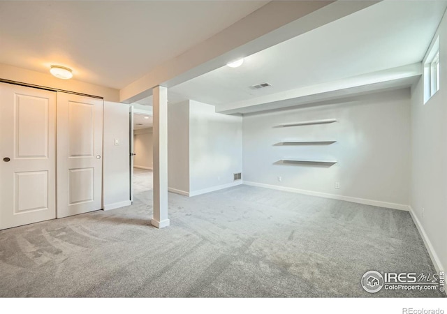 basement with light colored carpet