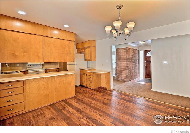 kitchen featuring sink, stainless steel range with electric cooktop, dark hardwood / wood-style flooring, and decorative light fixtures