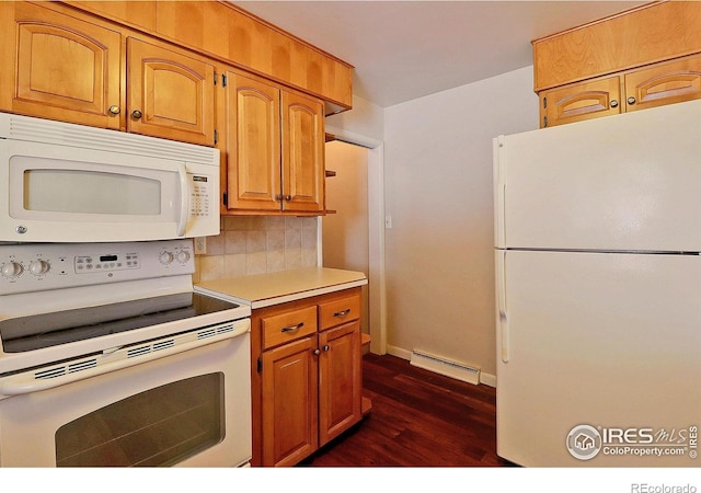 kitchen featuring dark wood-type flooring, white appliances, and backsplash