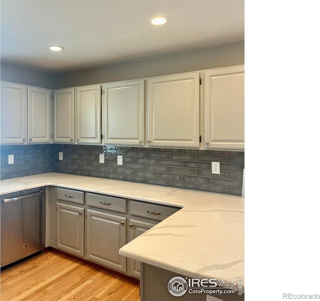 560 S 9th St, Berthoud, CO 80513 - kitchen featuring dishwasher, light wood finished floors, light stone countertops, decorative backsplash, and recessed lighting