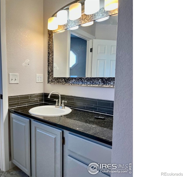 560 S 9th St, Berthoud, CO 80513 - bathroom with vanity and a textured wall