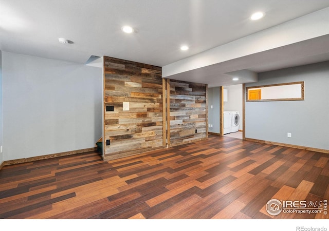 560 S 9th St, Berthoud, CO 80513 - finished below grade area with wood finished floors, washer and clothes dryer, recessed lighting, baseboards, and wood walls