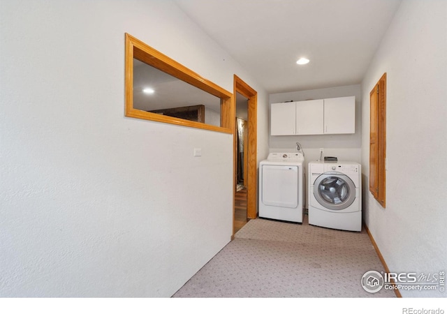560 S 9th St, Berthoud, CO 80513 - laundry room with washing machine and dryer, cabinet space, light colored carpet, and recessed lighting