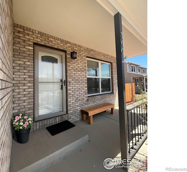 560 S 9th St, Berthoud, CO 80513 - entrance to property with a porch and brick siding