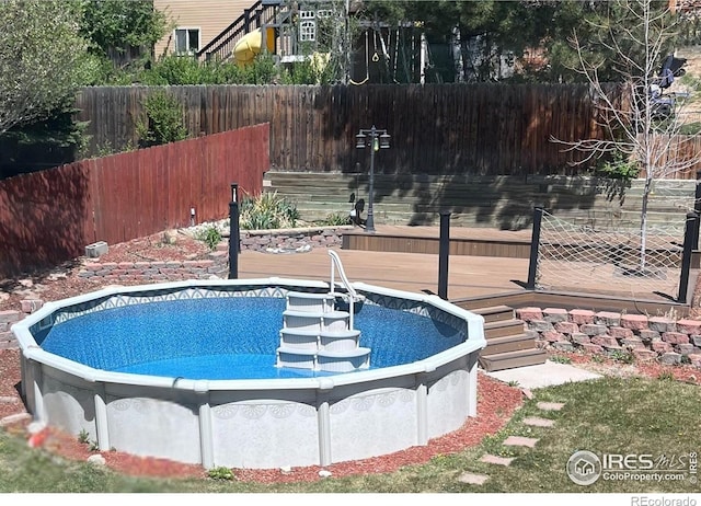 560 S 9th St, Berthoud, CO 80513 - view of swimming pool featuring a deck and fence
