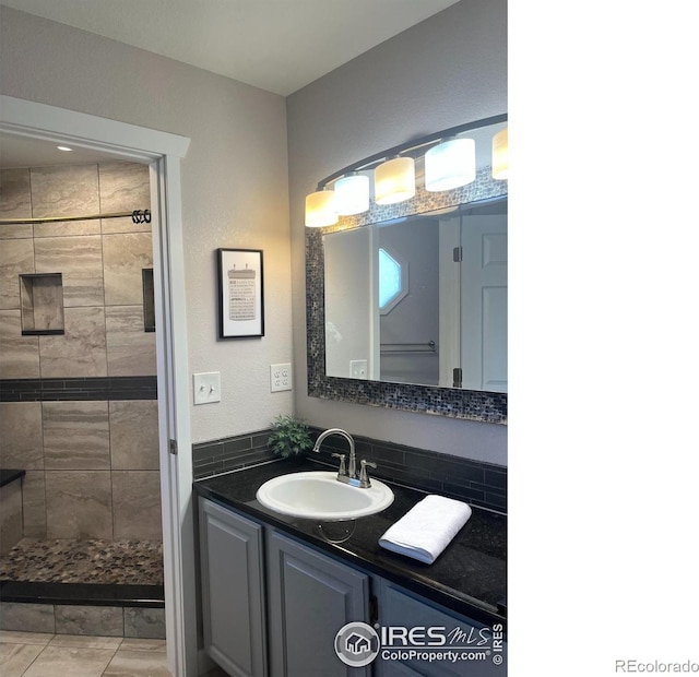 560 S 9th St, Berthoud, CO 80513 - bathroom featuring a shower stall and vanity