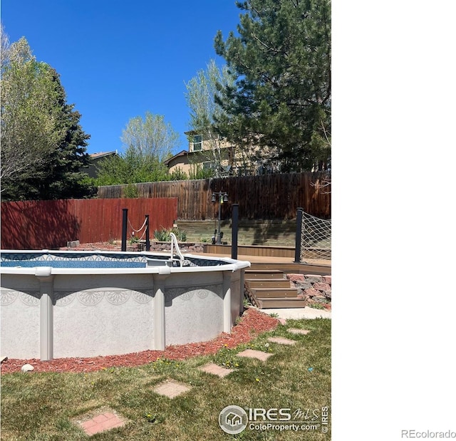 560 S 9th St, Berthoud, CO 80513 - view of swimming pool with fence