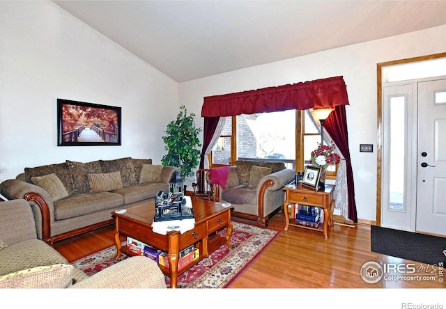 2707 Sedona Hills Dr, Loveland, CO 80537 - living room with lofted ceiling and hardwood / wood-style flooring