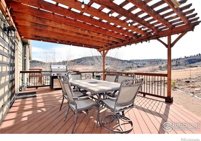 2707 Sedona Hills Dr, Loveland, CO 80537 - deck featuring a mountain view, area for grilling, a rural view, and a pergola