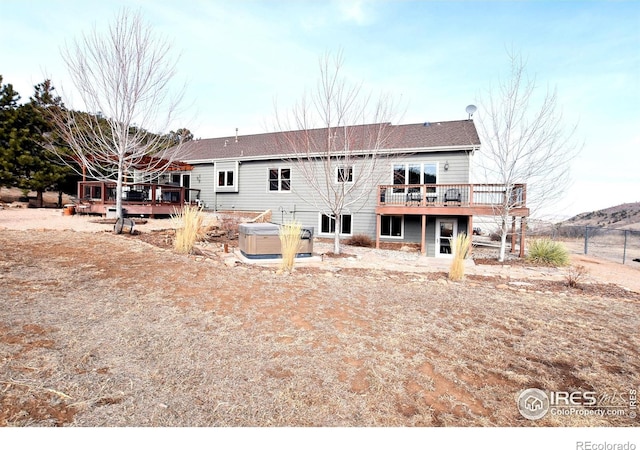 2707 Sedona Hills Dr, Loveland, CO 80537 - rear view of house with a hot tub and a deck