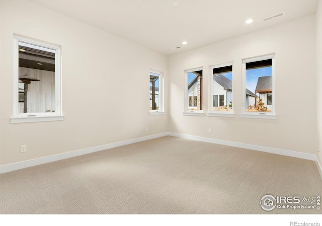 unfurnished room featuring carpet floors