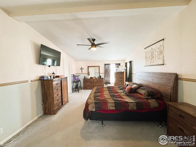 carpeted bedroom with lofted ceiling with beams