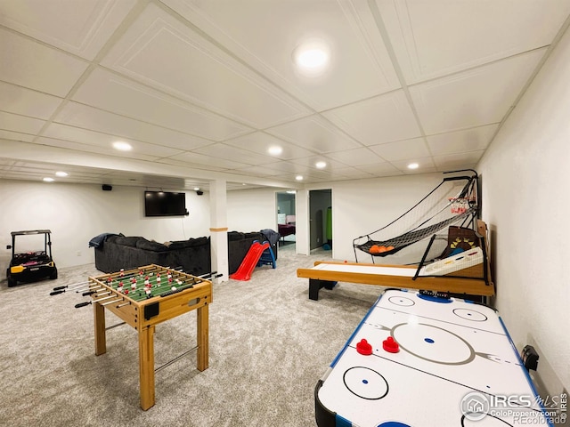 game room featuring carpet floors and a drop ceiling