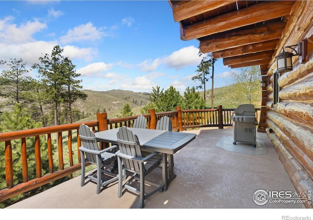 117 Crocus Dr, Bellvue, CO 80512 - view of patio / terrace featuring outdoor dining area, a mountain view, and grilling area