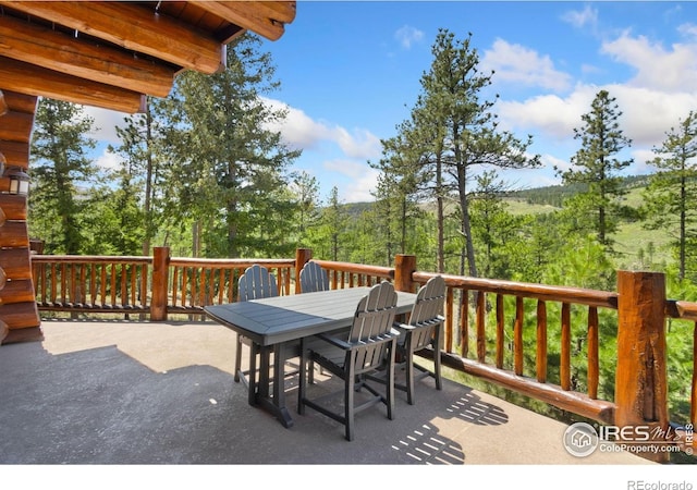 117 Crocus Dr, Bellvue, CO 80512 - wooden terrace featuring outdoor dining space
