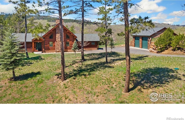 117 Crocus Dr, Bellvue, CO 80512 - log cabin featuring log siding, driveway, a front yard, and a mountain view