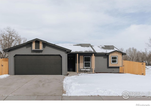 ranch-style home with a garage