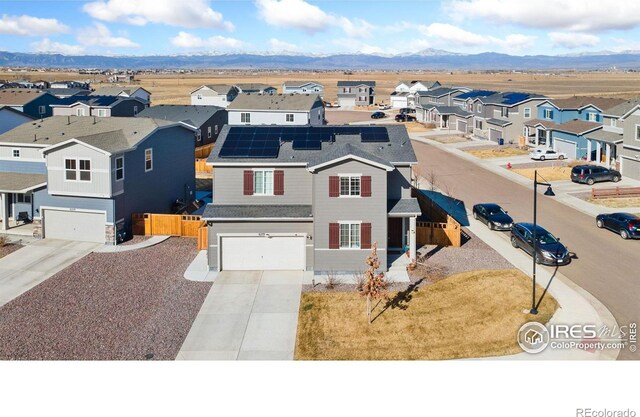 drone / aerial view featuring a mountain view and a residential view