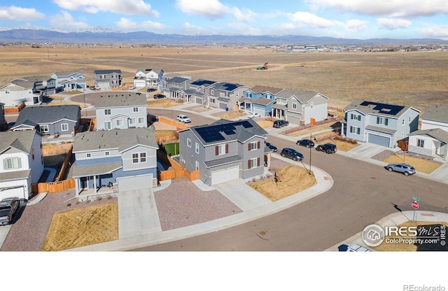 aerial view featuring a residential view and a mountain view