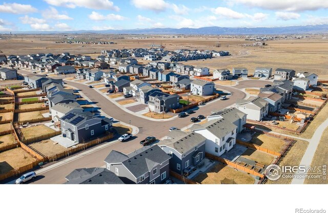 aerial view featuring a mountain view and a residential view