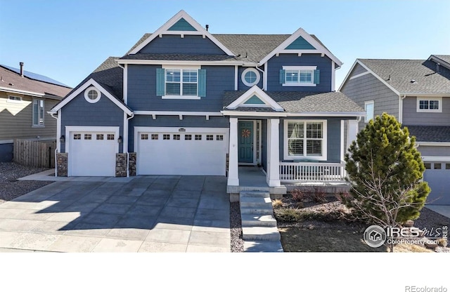 view of front of house with a garage and covered porch