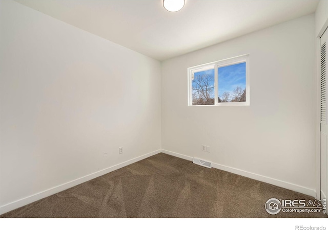 empty room featuring carpet