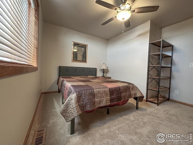 carpeted bedroom featuring ceiling fan