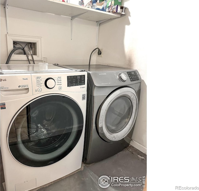 laundry room featuring washing machine and clothes dryer