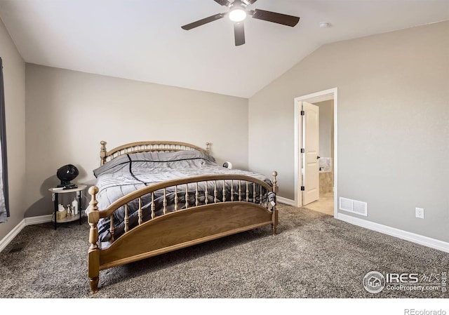 carpeted bedroom with vaulted ceiling, ceiling fan, and ensuite bath