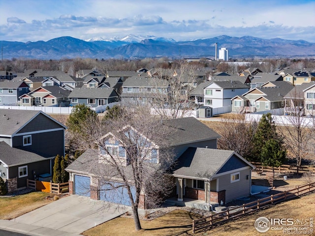 birds eye view of property featuring a mountain view