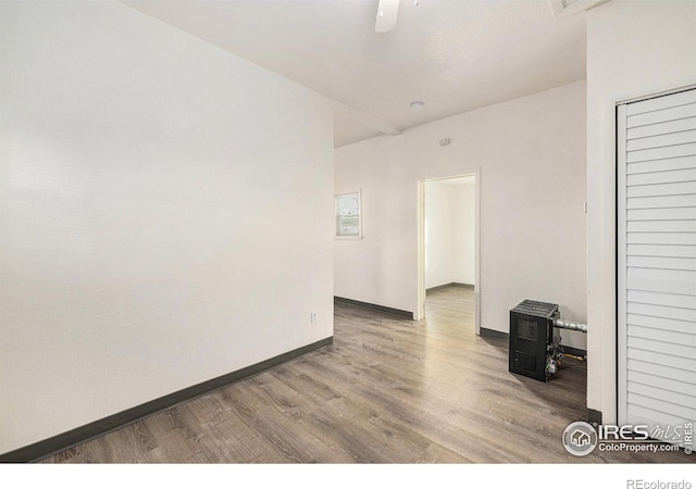 empty room featuring ceiling fan and light wood-type flooring