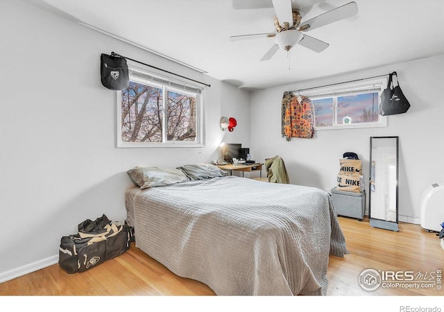 bedroom featuring wood-type flooring and ceiling fan