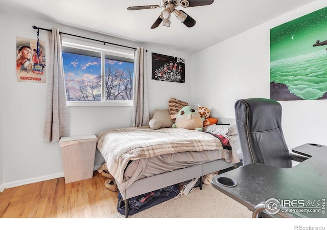 bedroom with wood-type flooring and ceiling fan