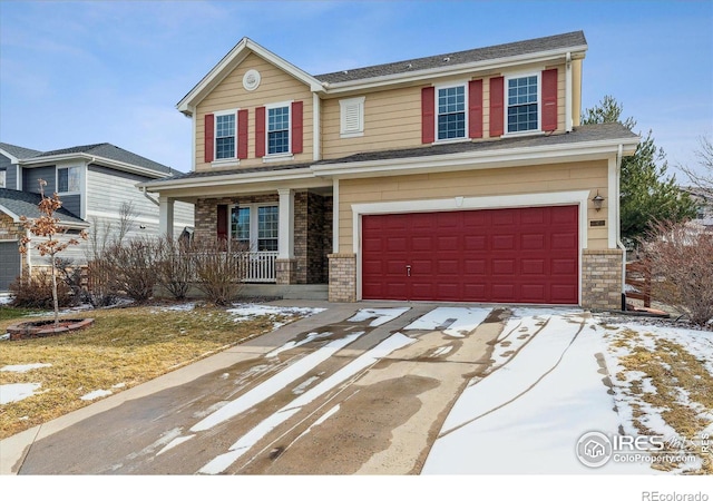 view of front of house with a garage and covered porch