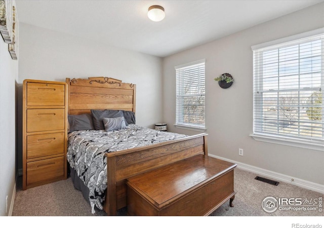 bedroom with light carpet