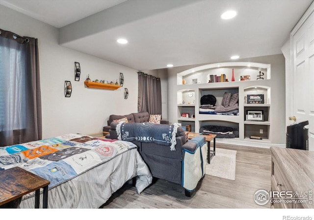 bedroom with light hardwood / wood-style flooring