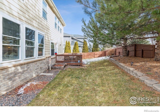 view of yard with a wooden deck